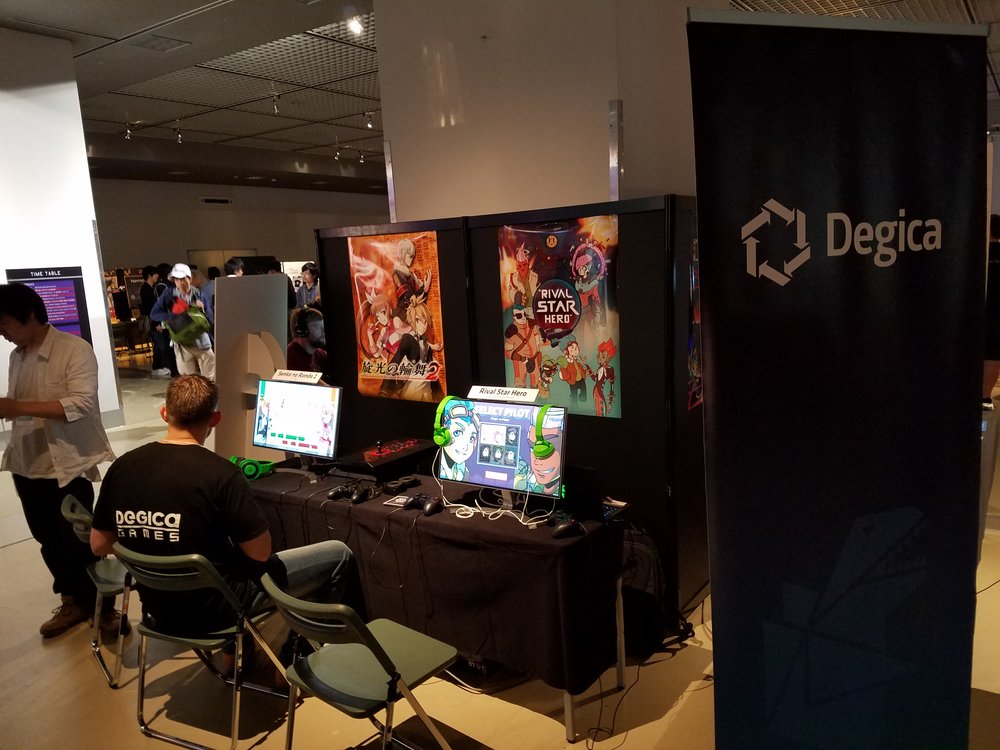 Degica setting up their booth for BitSummit